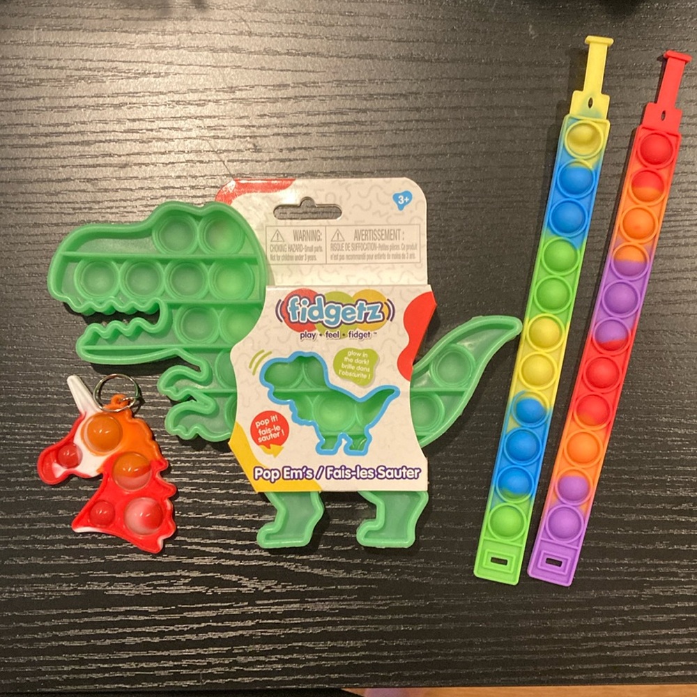 Pop-Its Set of 4 includes Glow In Dark Dinosaur New Kids Sensory Autism Fidget